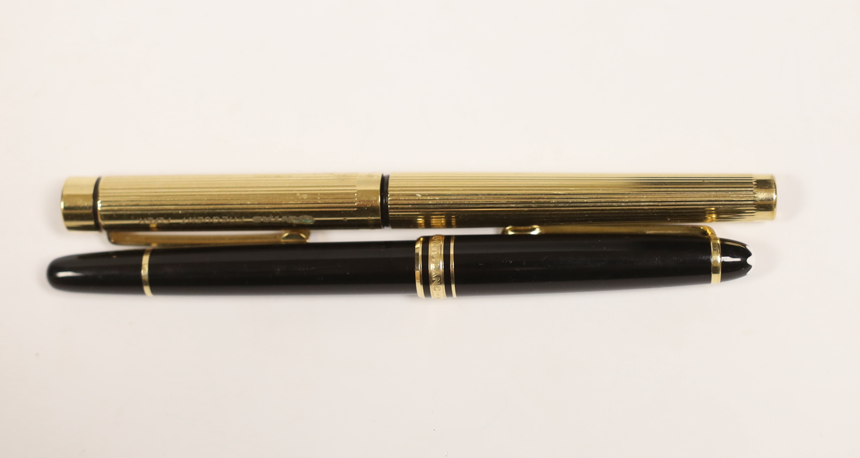 A Montblanc fountain pen and a promotional Qantas ‘Frequent Flyer’ pen